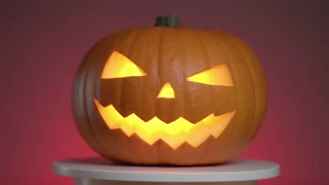 Continuous rotation of halloween pumpkin with glowing fanar inside Video stock 163155003
