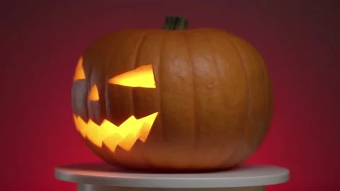 Continuous rotation of halloween pumpkin with glowing fanar inside Stock Footage 163265158