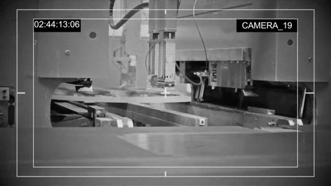 Continuous sheet of metallic material being fed through machine. CCTV video 库存影片 108603227