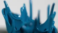 Continuous Splashes Of Blue Paint Isolated On White In Slow Motion Stock Footage