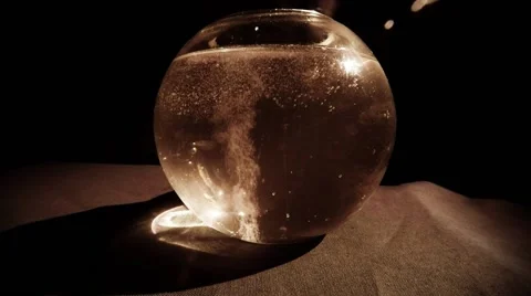 Continuous Stream of White Bubbles Rises up in a Glass in Darkness Stock Footage 61317702