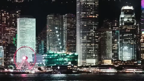 A continuous video showing the illuminated Hong Kong skyline from a fixed Stock Footage 338280468