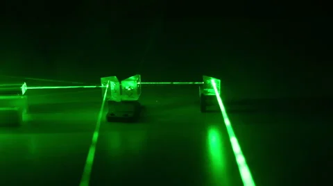 Continuous wave green laser propagates through the optical components. Stock Footage 57541841