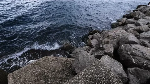 Continuously changing sea or ocean surface, breaking waves on rocks Stock Footage 234000101