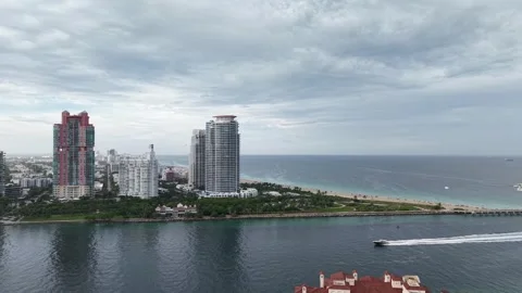Continuum Tower &amp; South Beach Coastline – Aerial from Fisher Island Stock Footage 312533733