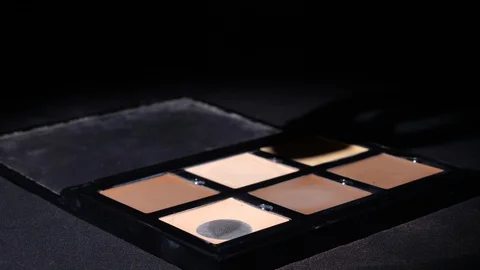 Contour blending sponge and makeup palette Stock Footage 127609953