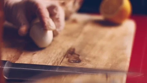 Contour effect of Cut boiled eggs into rings with a knife on a wooden board Stock Footage 240632454