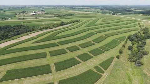 Contour Farming is a conservation practice that involves planting across a 스톡 동영상 345024797