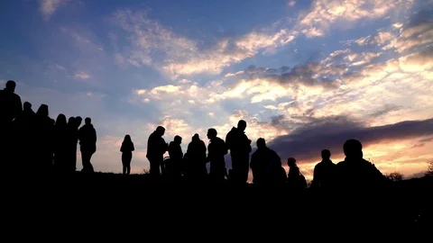 Contour of people on a background of beautiful evening sky Stock Footage 75075211