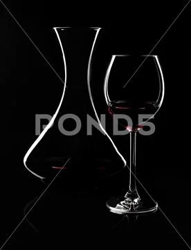 Contours of red wine glass and decanter Stock Photos