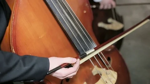 Contrabass fiddlestick strings play. Close-up Stock Footage 73587168