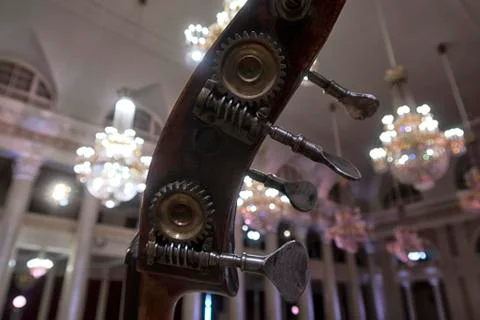 Contrabass on stage in front of an empty hall Stock Photos
