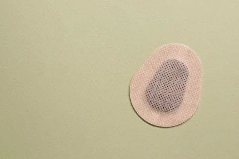 Contraceptive patch on green background, top view. Space for text Stock Photos