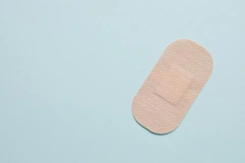Contraceptive patch on light blue background, top view. Space for text Stock Photos