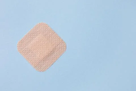 Contraceptive patch on light blue background, top view. Space for text Stock Photos