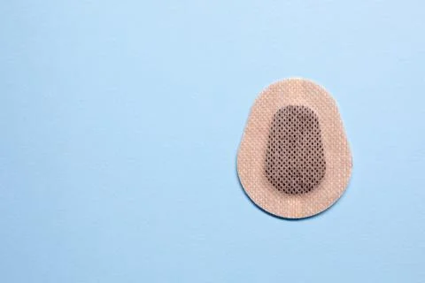 Contraceptive patch on light blue background, top view. Space for text Stock Photos