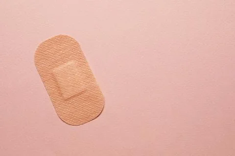 Contraceptive patch on pink background, top view. Space for text Stock Photos