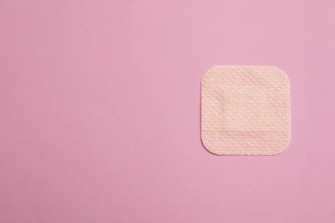 Contraceptive patch on pink background, top view. Space for text Stock Photos