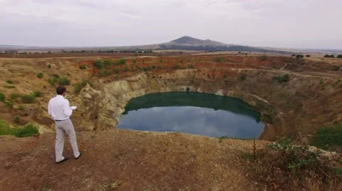 Contract developer businessman looking around a mine conceptual video Video stock 67969311