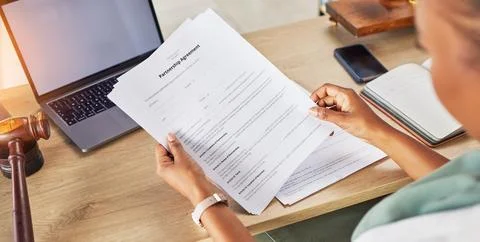 Contract, document and person hands for law agreement, partnership and hiring or Stock-Fotos