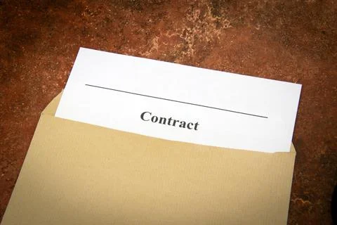 Contract document in envelope on a table Stock Photos