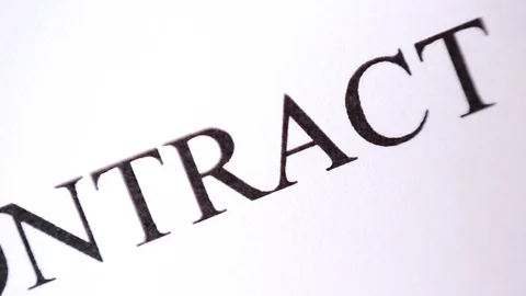"Contract" inscription under macro focus Vídeos de archivo 95771491