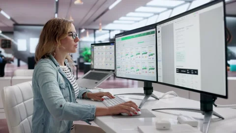 Contract Manager Reviewing Agreement Lifecycle Using Laptop For Compliance Stock Footage 343878601