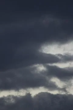 Contracting thunderstorm gray blue clouds sky Stock Photos