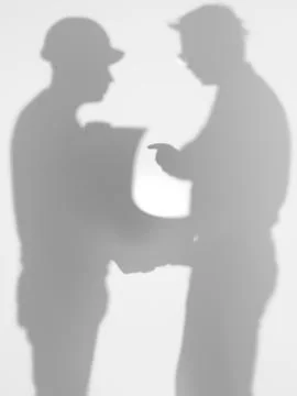 Contractor and engineer discussing a plan, silhouettes Illustrazione stock