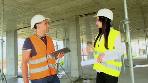 Contractor and inspector discuss special work processes Stock Footage 317618816