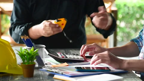 Contractor construction engineer meeting together on architect table at construc Stock Footage 231693408