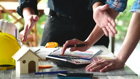 Contractor construction engineer meeting together on architect table at construc Stock Footage 231695944