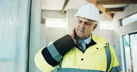 Contractor, construction or man with neck pain, injury or site risk with Stock Photos