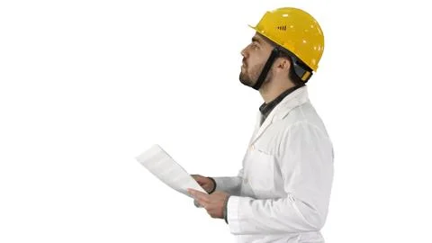 Contractor engineer walking with papers and checking arround on white background Stock Photos