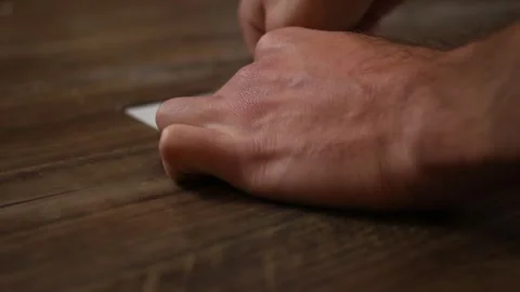 Contractor installs drain plug in drain in finished basement floor Stock Footage 290459358