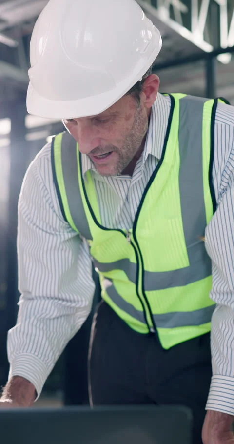 Contractor, laptop and talking with man for construction project, renovation or Stock Footage 340600235