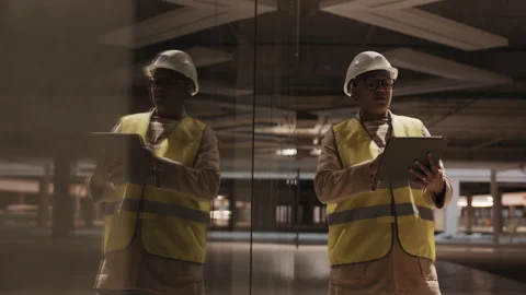 Contractor Making Notes on Tablet Computer Stock Footage 148263823