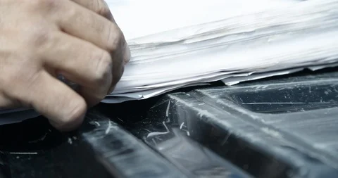 Contractor opening blue prints at pickup truck on constructon site Stock Footage 103217606