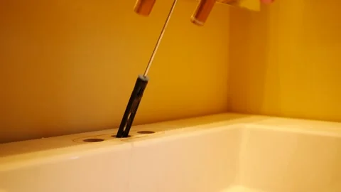 A Contractor or Plumber removes old Bathroom Faucet 스톡 동영상 334003251