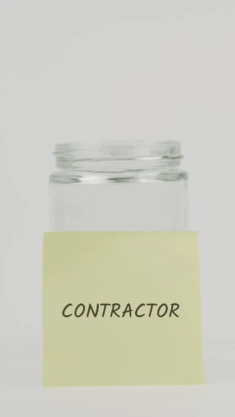 Contractor text or word on yellow sticky note attached to glass jar Stock Footage 311698419