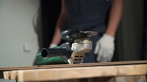 Contractor Using Circular Saw Cutting of New Laminate Flooring Renovation Stock Footage 104479858