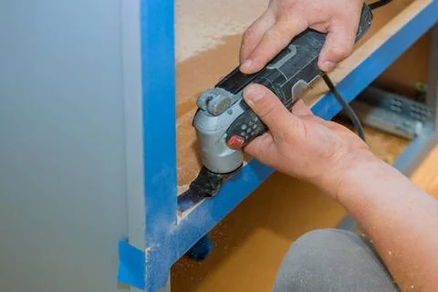  Contractor using oscillating multi functional cutting tool for handyman c... 写真素材