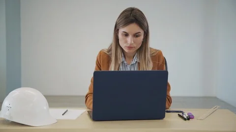Contractor woman using her personal computer and creating new pr Stock Footage 113664871