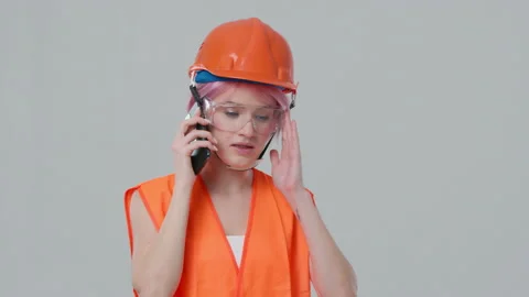 Contractor in working uniform and hardhat control according to plan Stock Footage 230706011
