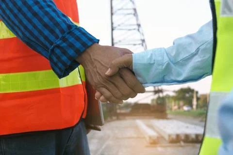 Contractors and engineers join hands to agree to work together. Construction  Stock Photos