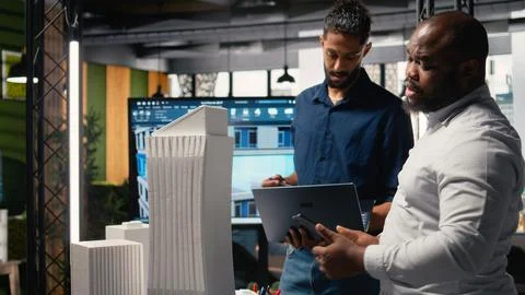 Contractors and property developers work together on a city planning initiative Stock Photos