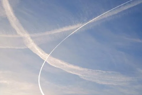 A contrail in the sky. Stock Photos