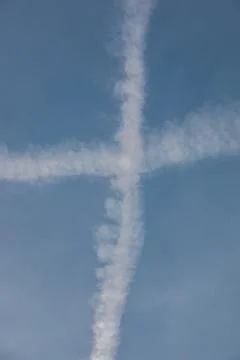 Contrails in the blue sky Stock Photos