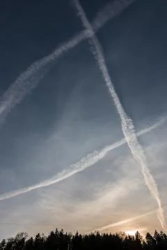Contrails in the blue sky Stock Photos