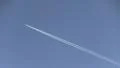 Contrails of jet in mid-air HD Footage